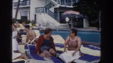 Miami Florida (1960): Two Women Relaxing And Listing By The Edge Of A Large Water