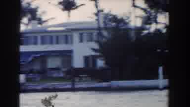 Miami Florida (1960): Woman In Dress Outside Of House Walking On Lawn With A