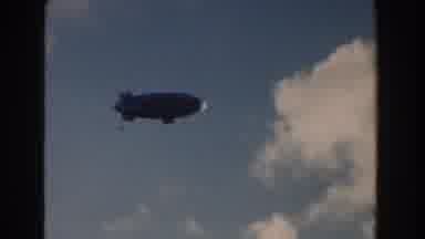 Miami Florida (1960): Silvery Large Dirigible Glides Gracefully Through Clouds On