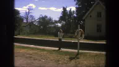 Sweden (1975): Two People Walking Around In A Garden During A Sunny Day