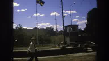 Sweden (1975): Person Walking And View Of Cars On Highway