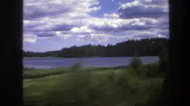 Sweden (1975): A Green Area Full Of Trees Like A Forest Near Of A Lake And A