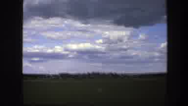 Sweden (1975): Shaky Video Of Sky Clouds And Field With Object Moving Left Across