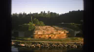 Sweden (1975): View Of A Green Field With Rocks On The Sides And A Lake In The