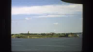 Sweden (1975): View Of Green Island Blue Water And White Object On A Sunny Day
