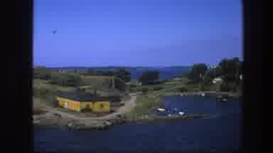 Sweden (1975): Old Footage Of A Small Village Built Around A Bay With Boats And