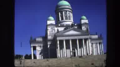 Sweden (1975): People Around A Big Beautiful Building Looking Like A Church With