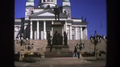 Sweden (1975): Casually Dressed Tourists Enjoy Plaza And Historic Statues Near