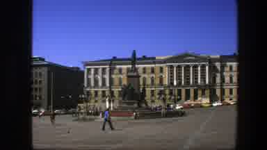 Sweden (1975): Square With People Walking And Monument In The Background
