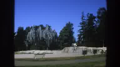 Sweden (1975): Person In White Pants Walking Along A Wall Of Natural Rocks