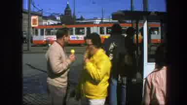 Sweden (1975): View Of Black Building Next To White Building With People Eating