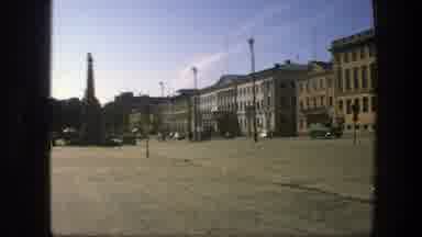 Sweden (1975): Buildings Captured In A Busy Town With Cars Driving Around