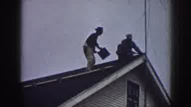 Nebraska (1958): Two Men Fixing The Top Of The Roof Together