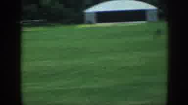 Nebraska (1958): Airplane Takes Off And Fly Above Grass Field And Trees Two Men