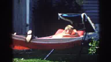 Nebraska (1958): Person Sits In Red Convertible Car On A Bright Sunny Day