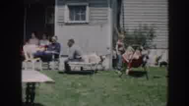 Nebraska (1958): A Group Of People Having A Party At The Backyard Of A White House