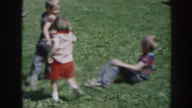 Nebraska (1958): Three Children Playing Roughly On The Grass In The Yard