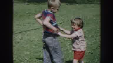 Nebraska (1958): A Crying Child Upset With Another Youngster In Grassy Area Where