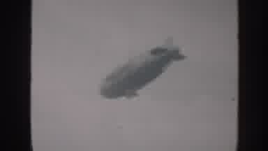 Nebraska (1958): Scenes Of Blimp Flying High In Air And Of A Woman Standing Next