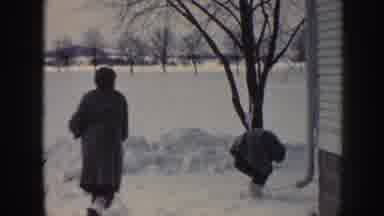 Nebraska (1958): Two Girls Throwing Snowballs At Each Other After Winter Snowstorm