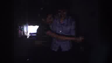 Nebraska (1958): Couple Dancing In The Dark And Woman Working In The Kitchen