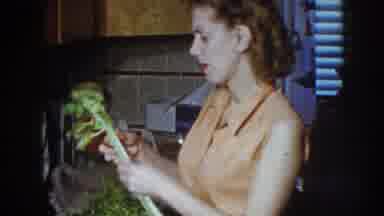 Nebraska (1958): A Woman In A Kitchen Holds A Paring Knife And A Stick Of Celery
