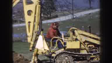 Nebraska (1958): Man In Red Using Digging Heavy Equipment Working Outside Physical