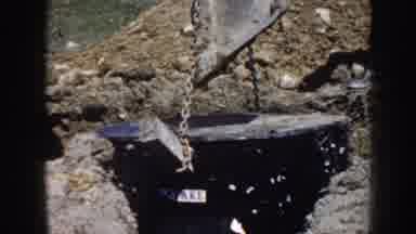 Nebraska (1958): Group Of Workers Placing A Large Metal Object Into The Group