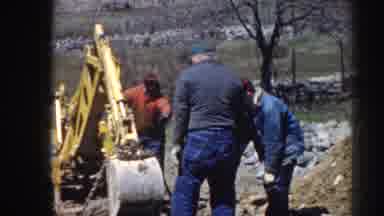 Nebraska (1958): Three Men Standing And Looking At Construction Equipment On A
