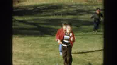 Michigan (1958): Three Small Children Are Happily Running And Playing In The Grass