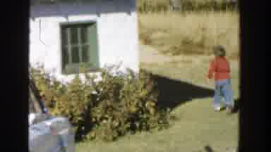 Michigan (1958): Children Running Around Outside Looking For Woman Hiding Behind