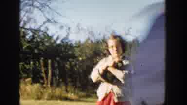 Michigan (1958): A Little Boy With A Red And Blue Hat Walking To The Camera Making
