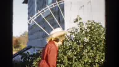 Michigan (1958): A Girl Wearing A Hat Drags Something From The Ground