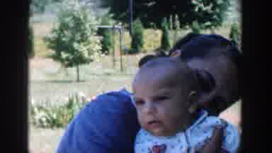 Michigan (1958): A Woman Cuddling Her Baby And Kissing Him At The Back Of His Neck
