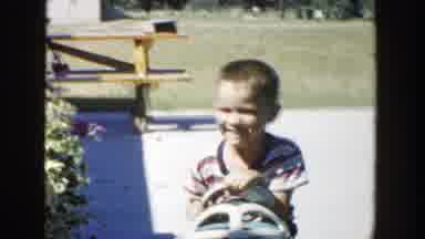 Michigan (1958): Two Boys With Toy Vehicles Playing In Front Of House And Lawn