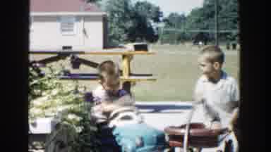Michigan (1958): Children Playing In A Yard While Adults Talking One In The Car
