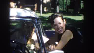 Michigan (1958): A Woman Talking To Driver Outside The Car