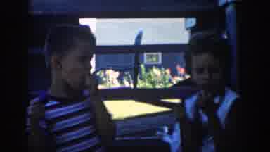 Michigan (1958): A Pair Of Kids Eating A Blue Ice Cream And A Mother Earring Her