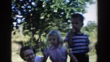 Michigan (1958): Woman Holding Baby Near Four Young Children On Grass Green