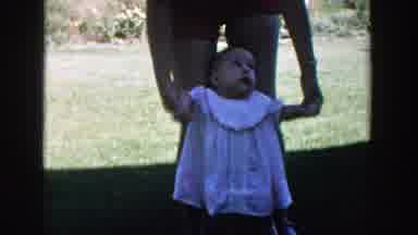 Michigan (1958): A Mother Holds Her Baby As She Practices How To Walk