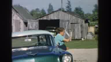 Michigan (1958): The Woman In Front A Car So She Signals Someone But She Is Shy
