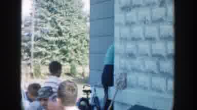 Michigan (1958): A Group Of Children Hanging Around The Outside Of An Entrance To