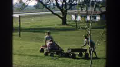 Michigan (1958): A Group Of Boys Riding Toy Motorbikes On The Field Reeling With