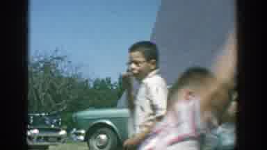 Michigan (1958): A Group Of Children Playing In Circles As A Woman Walks Away With