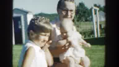Michigan (1958): Mother Holding Baby With Toddler Beside Her
