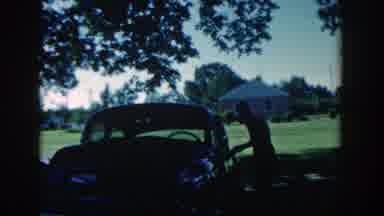 Michigan (1958): You Boy Works On Old Car In The Early s