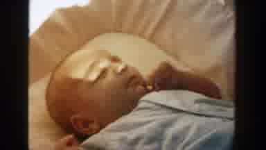 Michigan (1958): A View Of A Baby Payed Down On Cradle With Sun Light Entering In