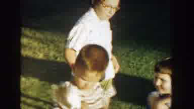 Michigan (1958): Little Children Play With A Very Cute Cat On The Grass