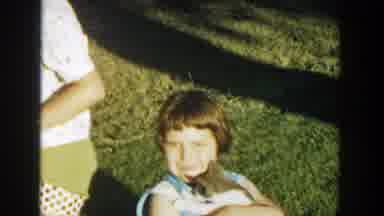 Michigan (1958): A Little Girl Earring Her Cat And Smiling To The Camera With Some
