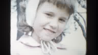 Michigan (1958): A Young Girl Smiling Into The Camera And A Young Boy Smiling Into